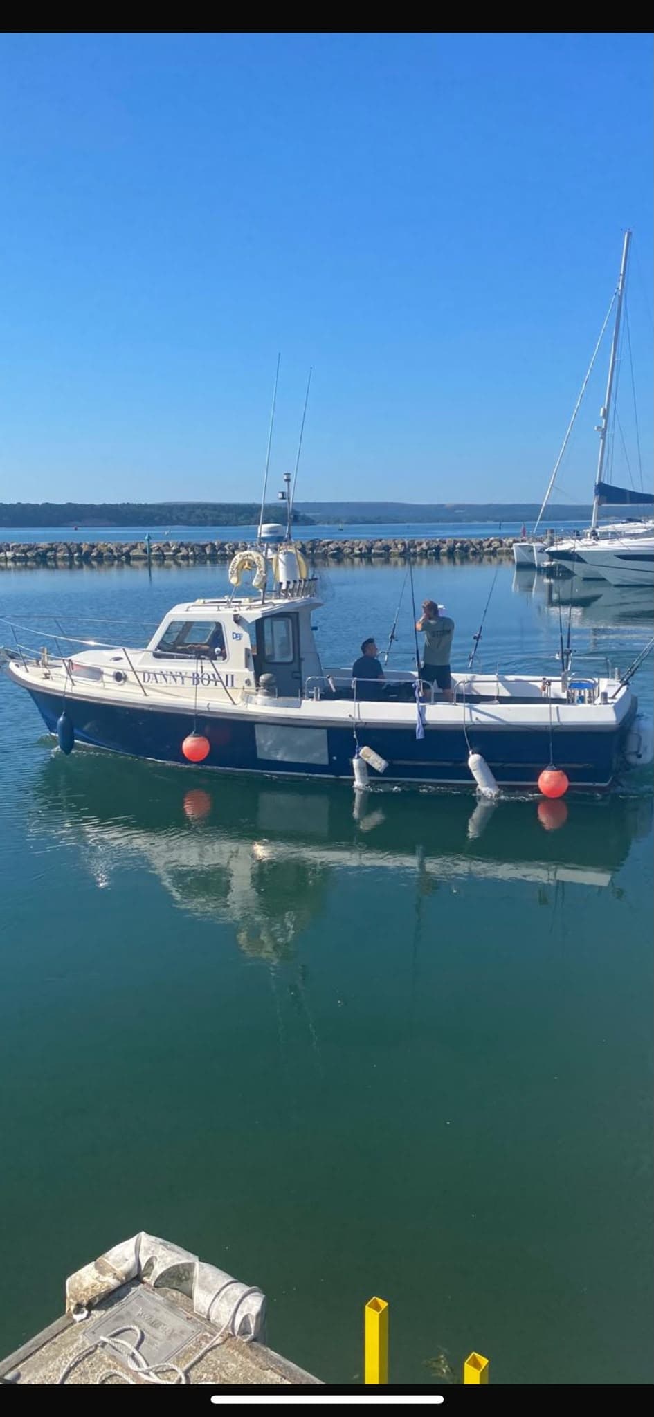 Danny Boy 2 fishing boat docked in a quiet harbour