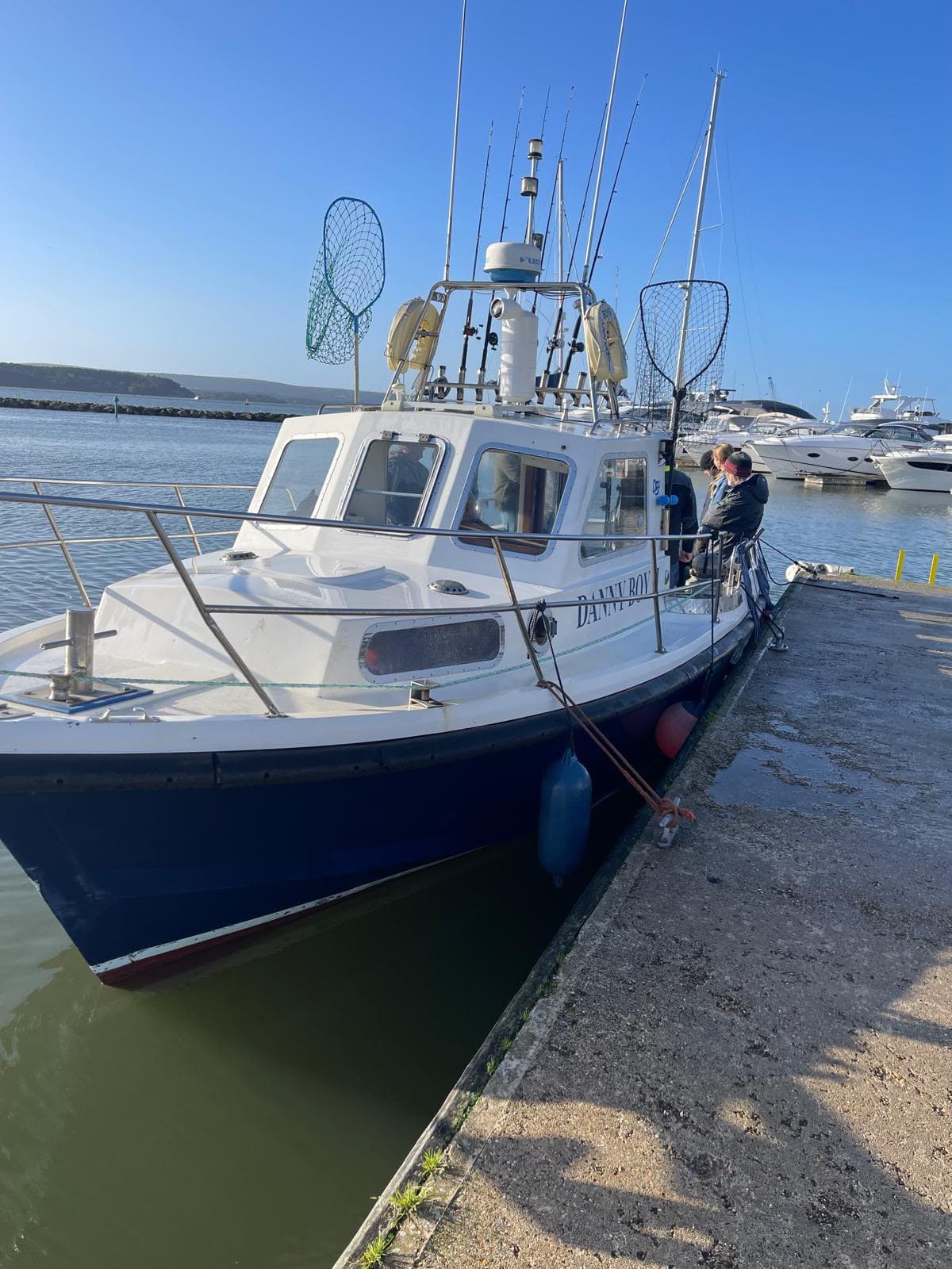 Danny Boy 2 fishing boat moored at the dock in bright daylight